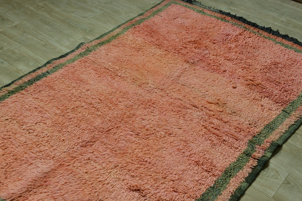 Faded orange vintage rug. handwoven in morocco